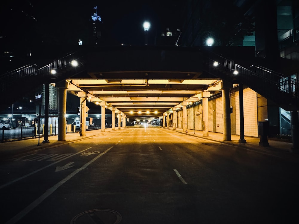 an empty parking lot at night with lights on