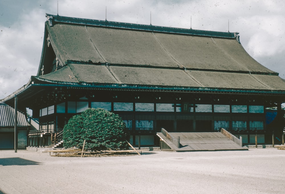 a large building with a tree in front of it