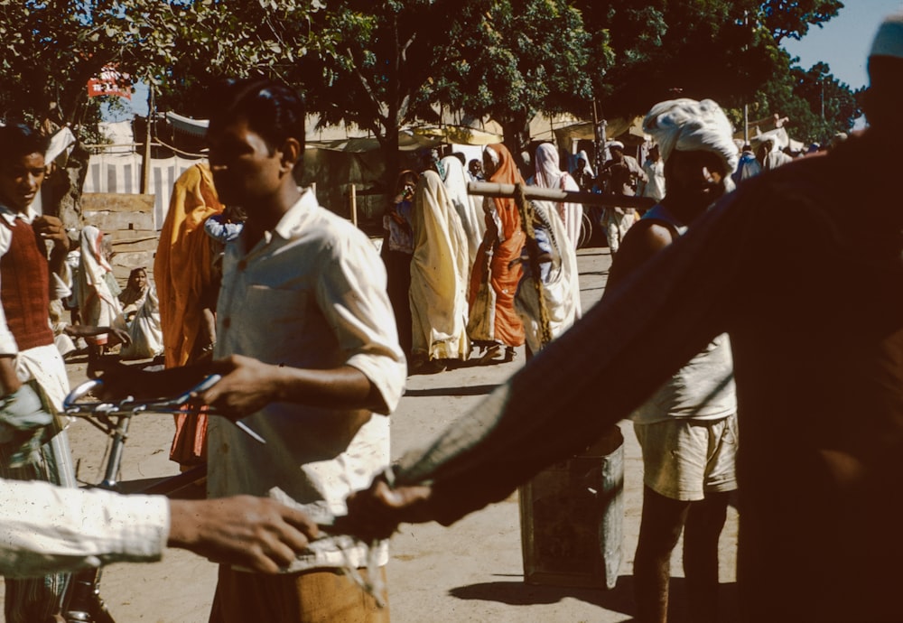 a group of people standing around each other