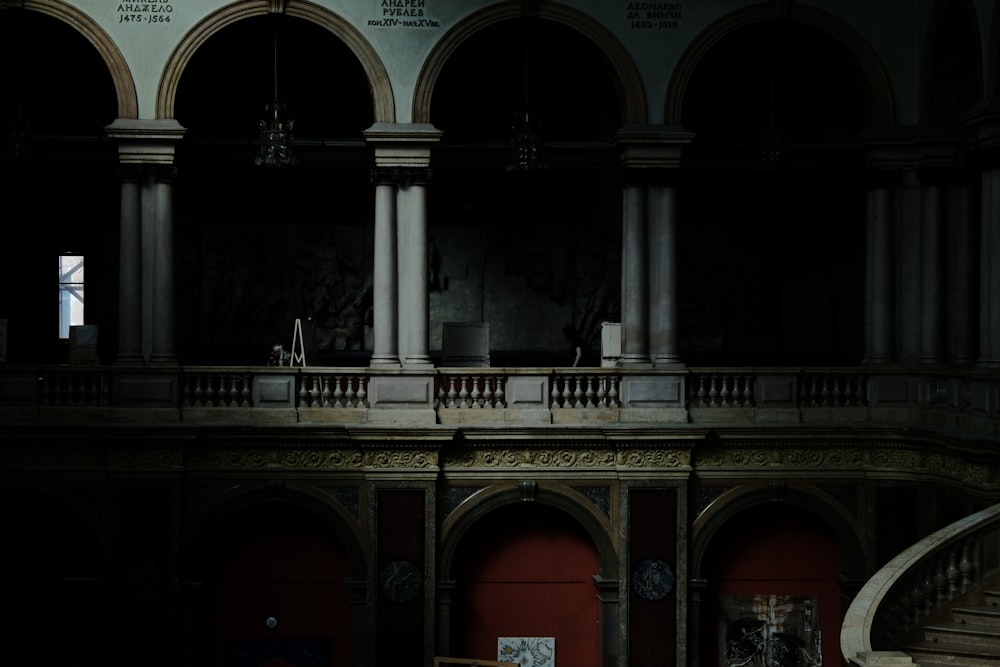 a person standing on a balcony in a building