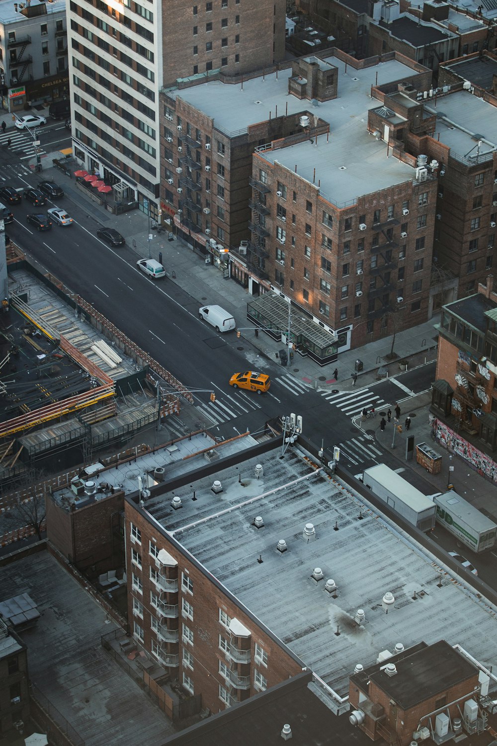 an aerial view of a city with tall buildings