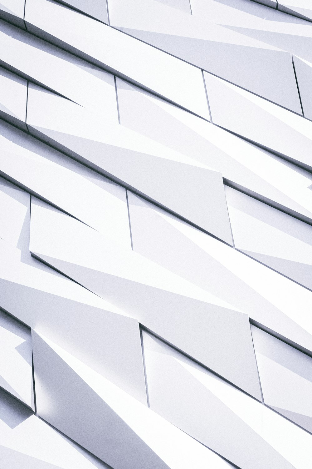 a close up of a building made of white tiles