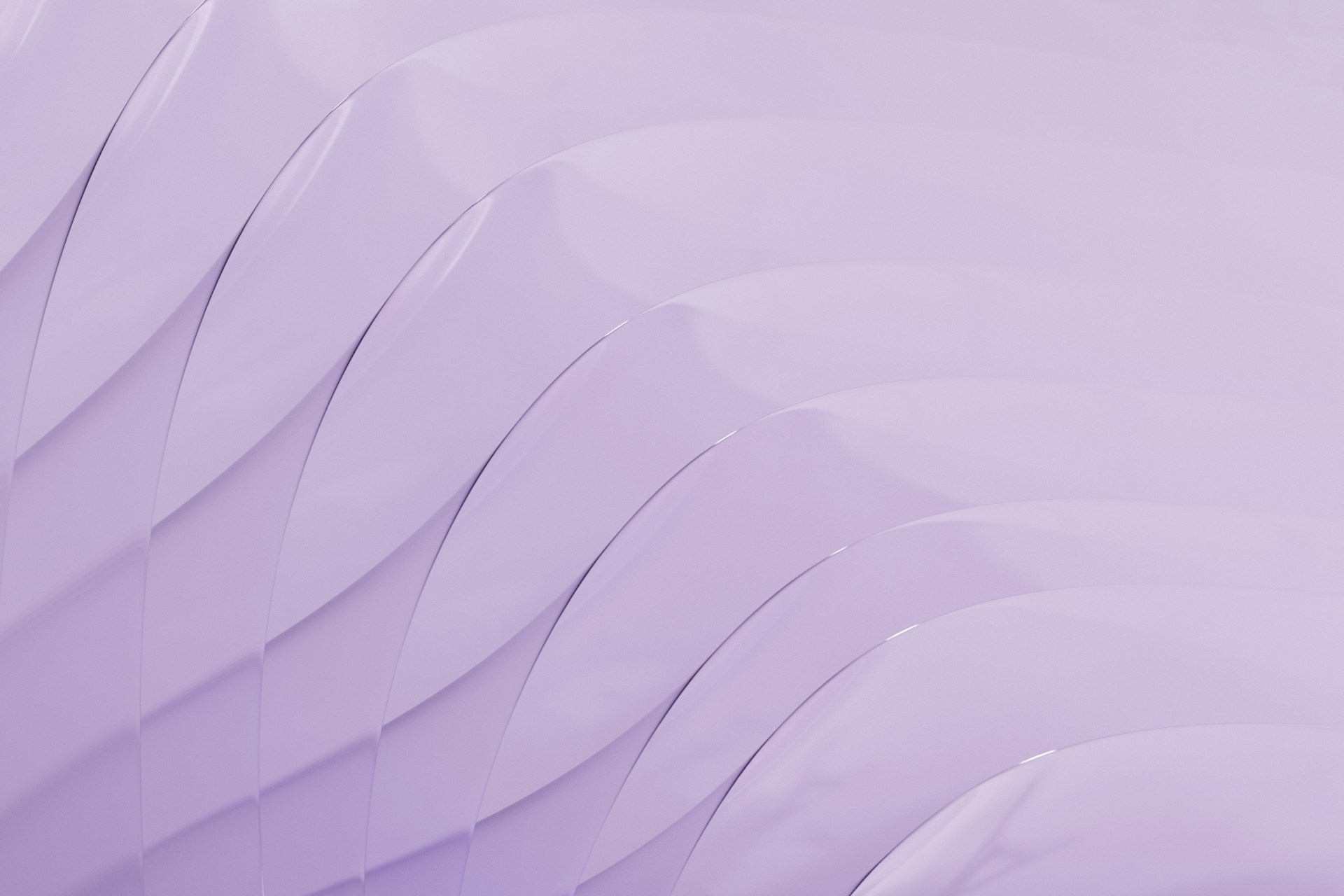 a close up of a purple background with wavy lines
