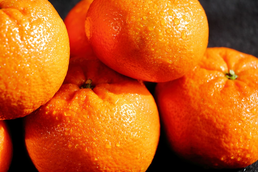 a pile of oranges sitting on top of each other