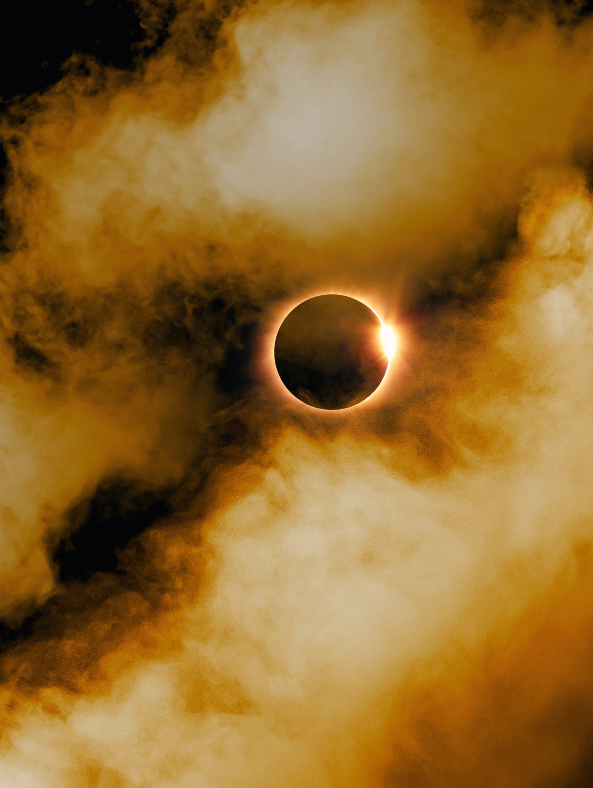 a solar eclipse seen through clouds in the sky