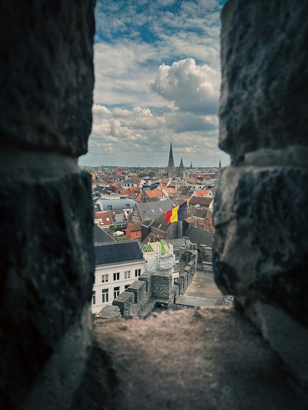 a view of a city through a stone window