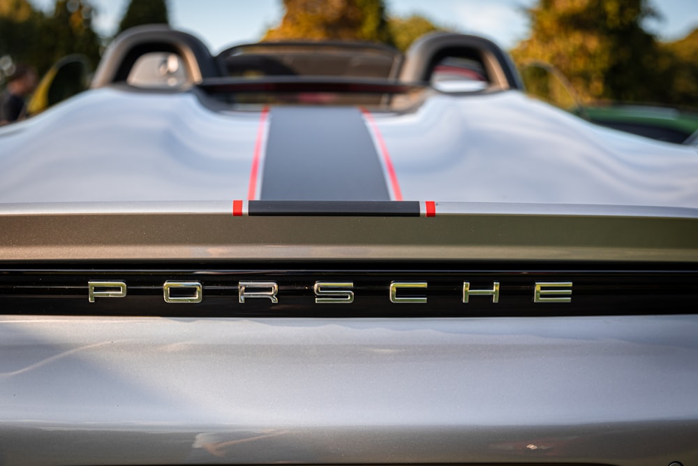 a porsche sports car parked in a parking lot