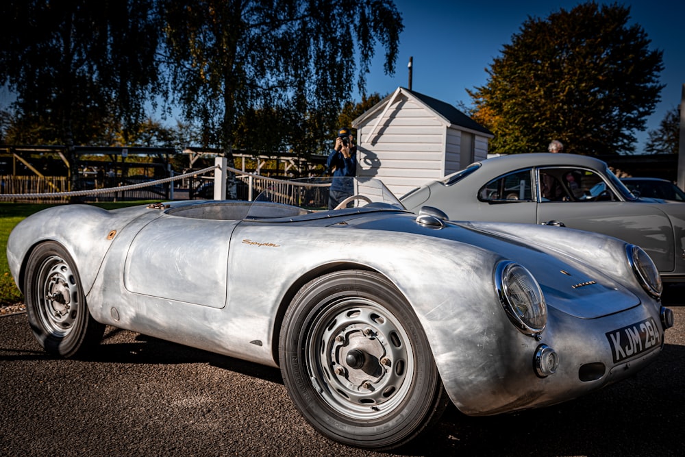 a silver sports car parked in a parking lot