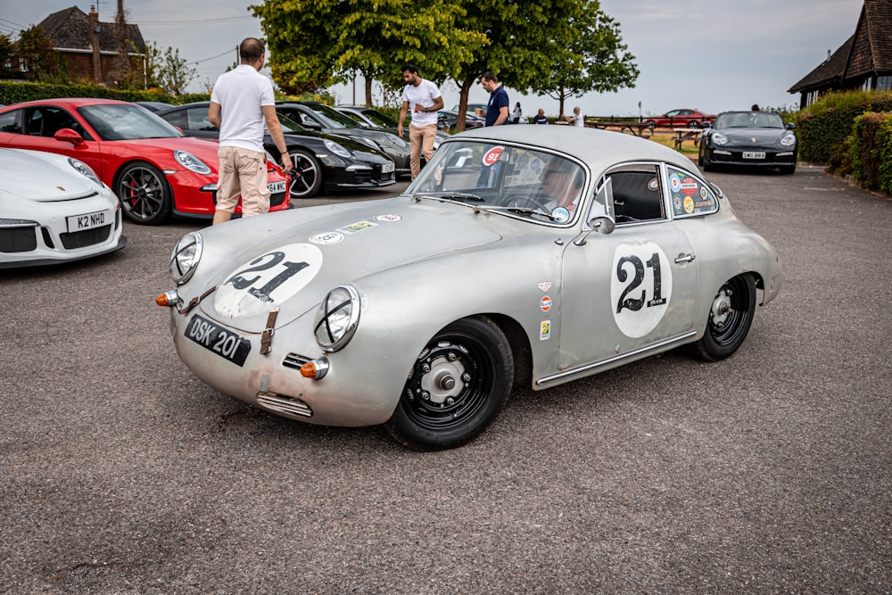 a silver sports car parked in a parking lot