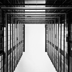 a black and white photo of a hallway