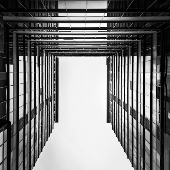 a black and white photo of a hallway