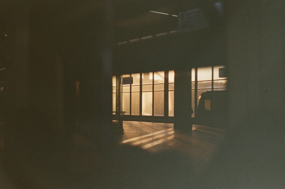 a dark room with a truck parked in it