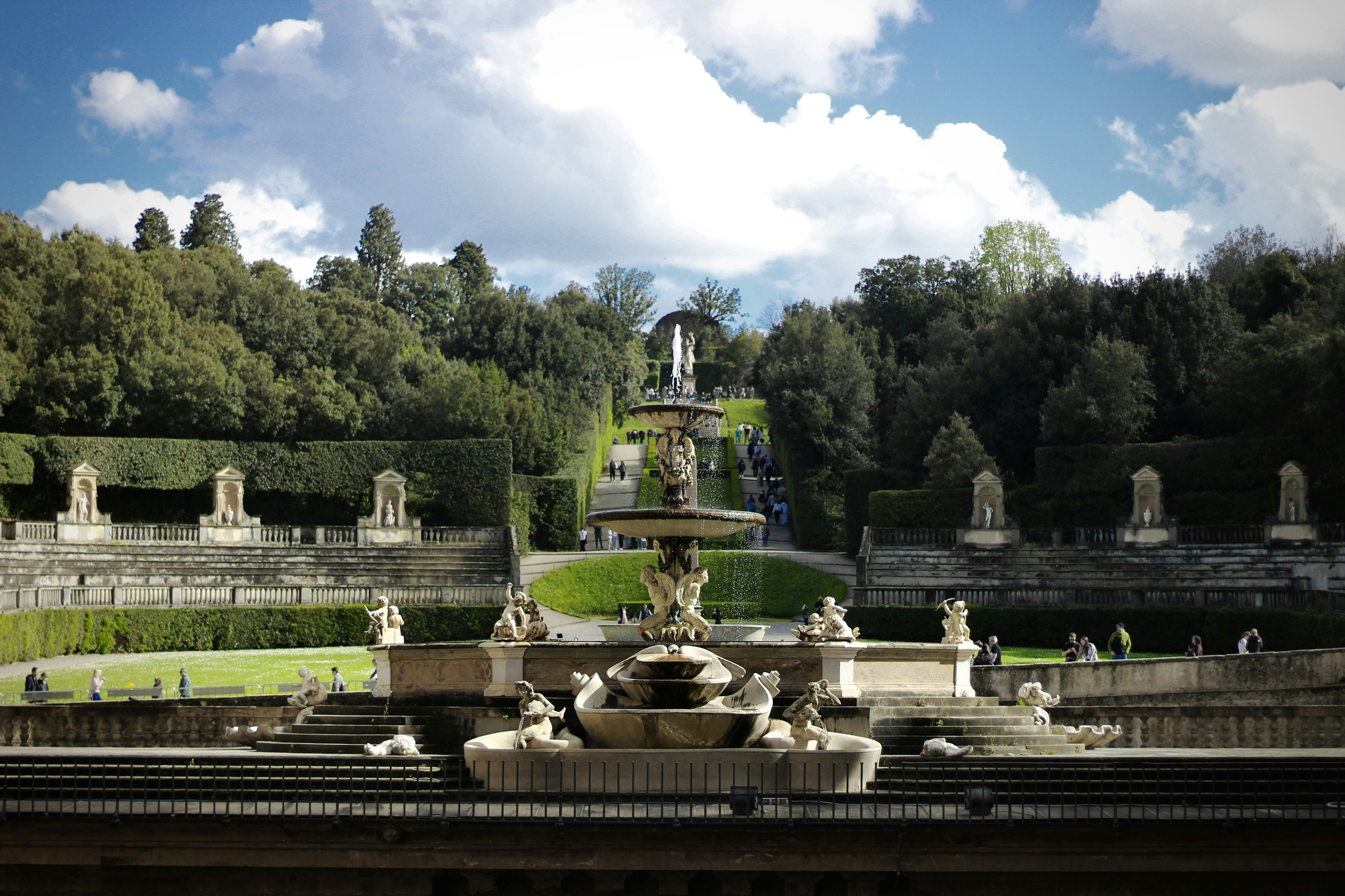 a view of a fountain in the middle of a park
