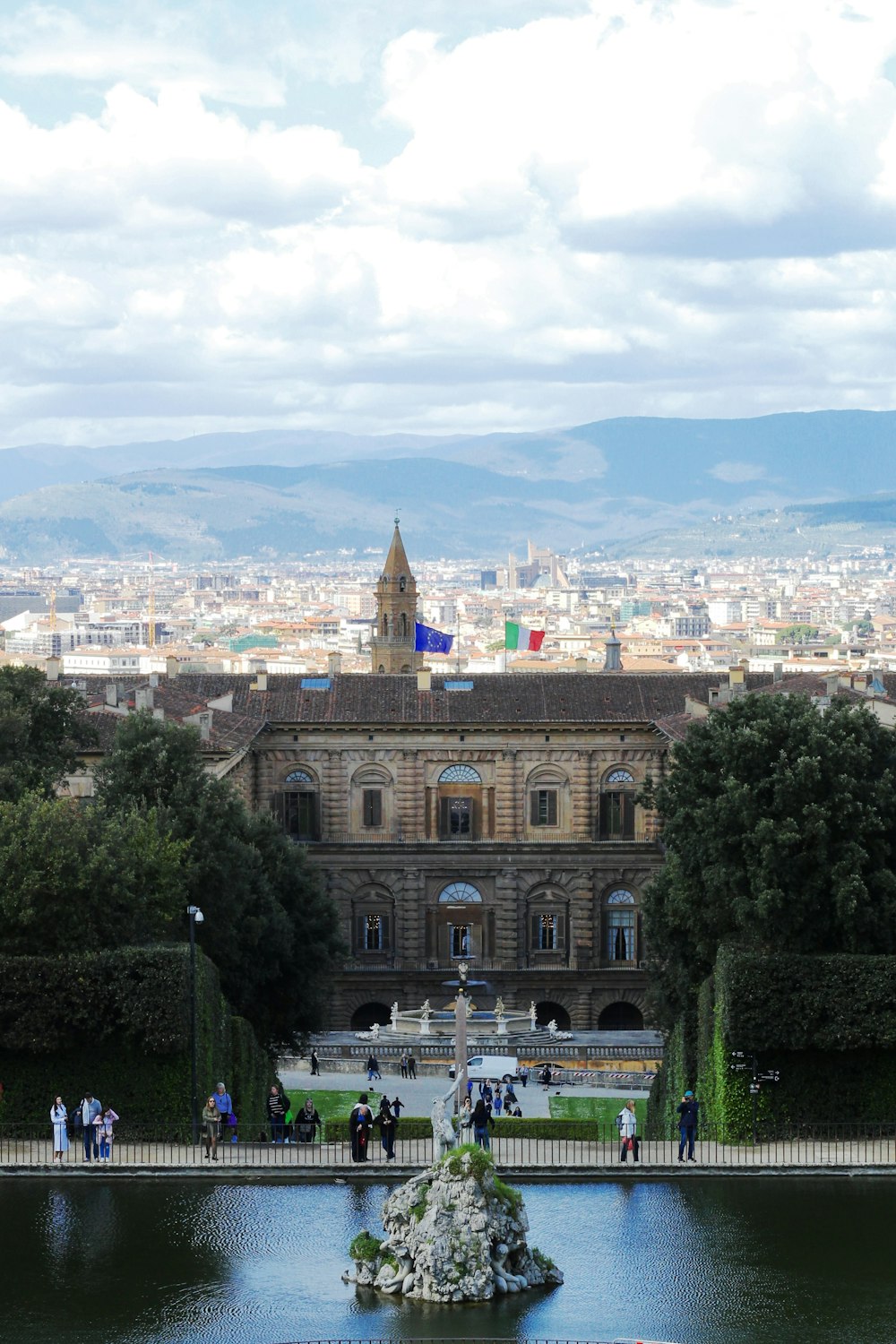 a large building with a fountain in front of it