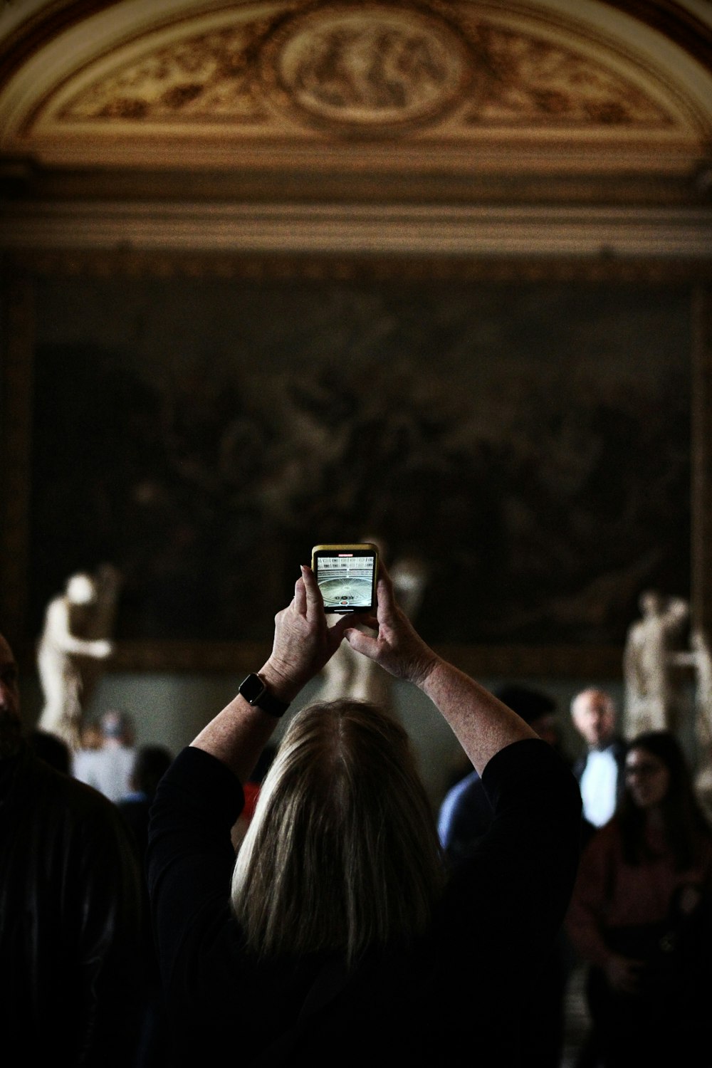 a person taking a picture with a cell phone