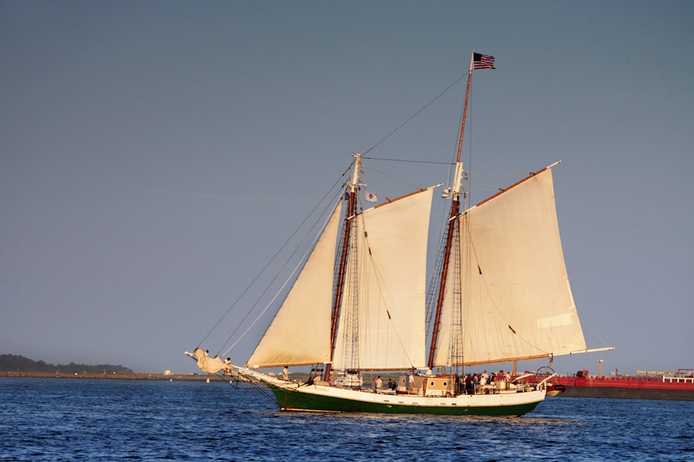 a sailboat sailing on a body of water