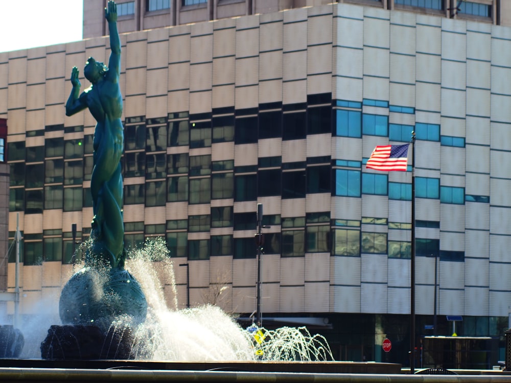a fountain with a statue of liberty on top of it