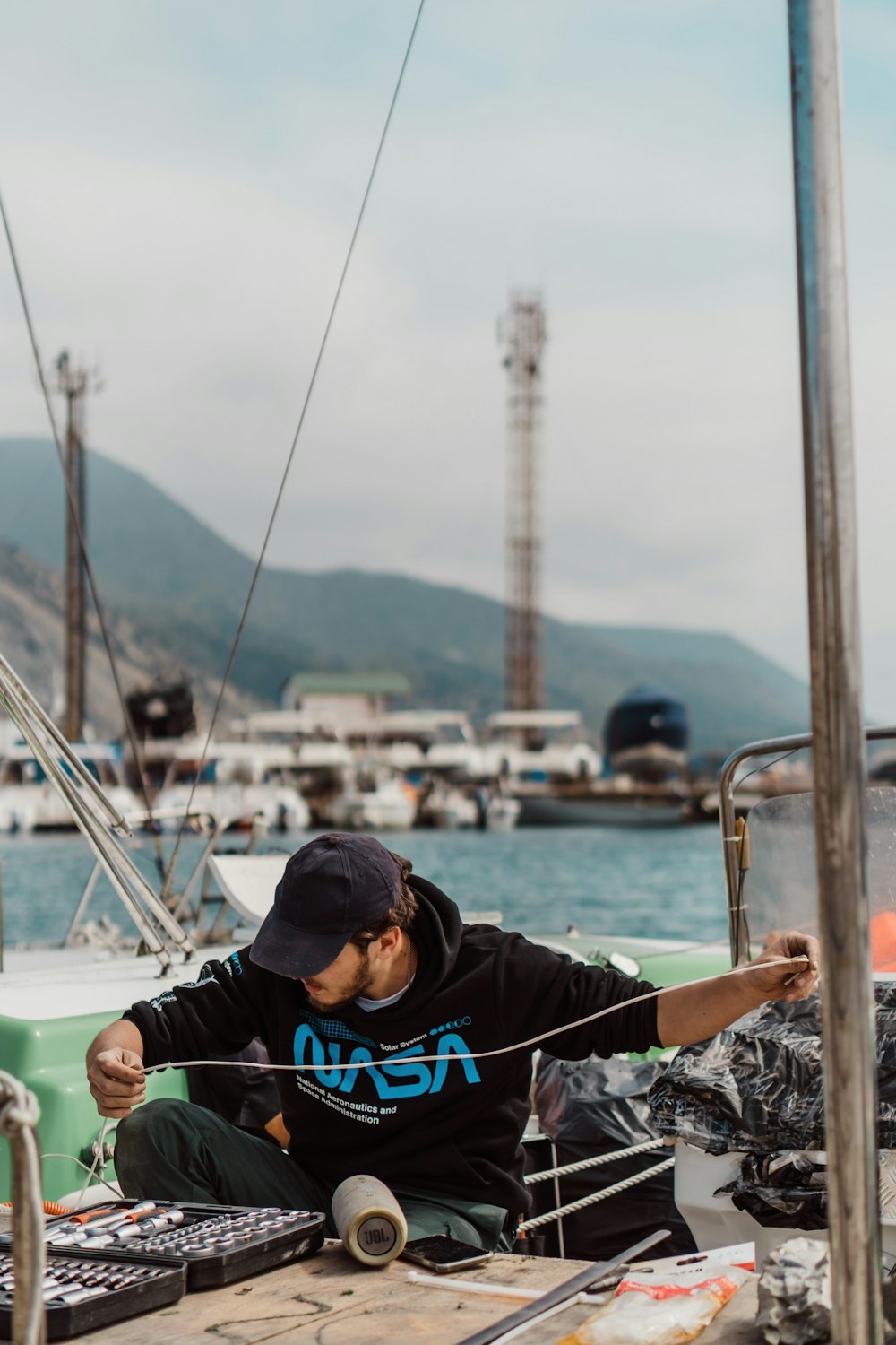 a man sitting on a boat in the water