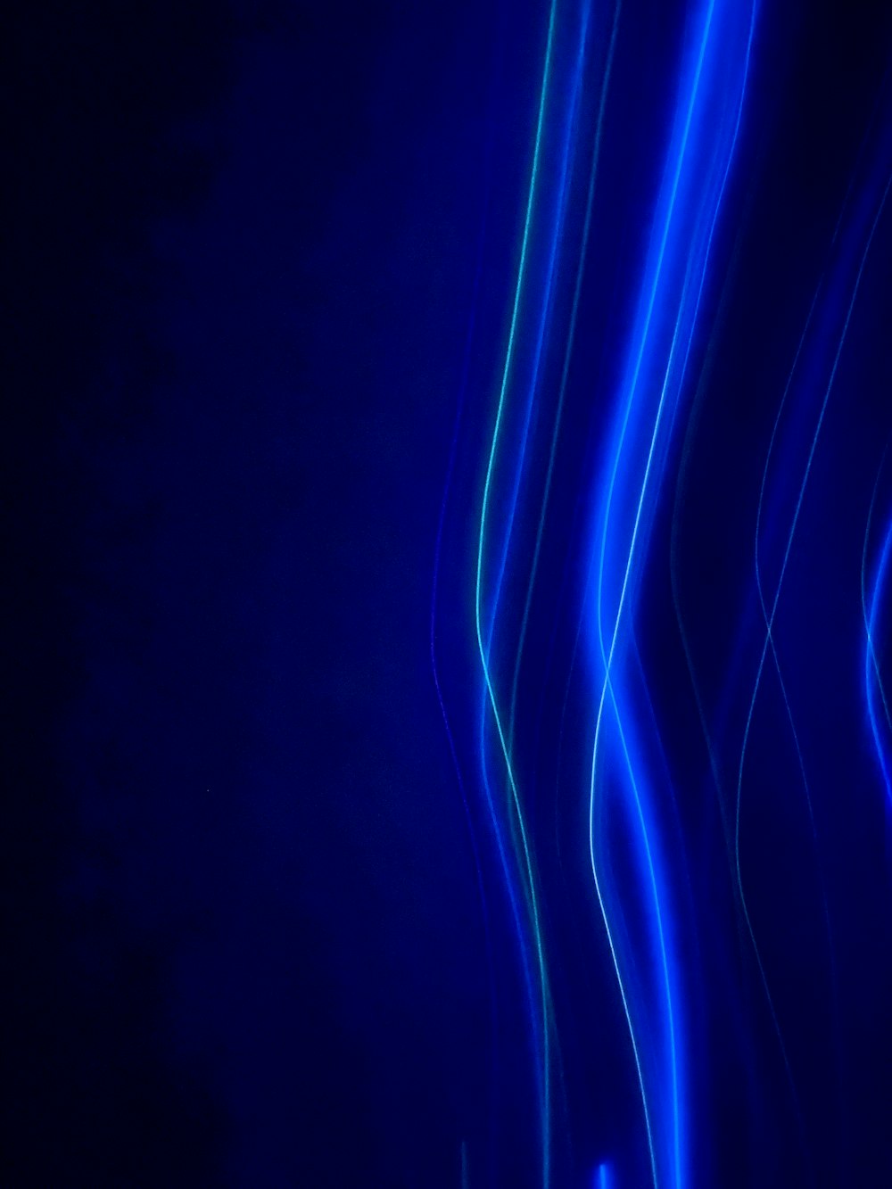 a dark blue background with lines of light