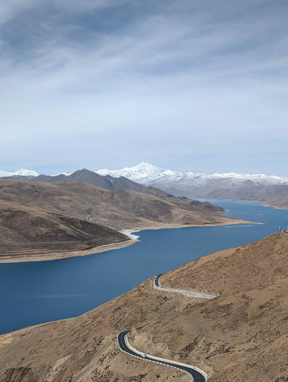 a winding road in the middle of a mountain range