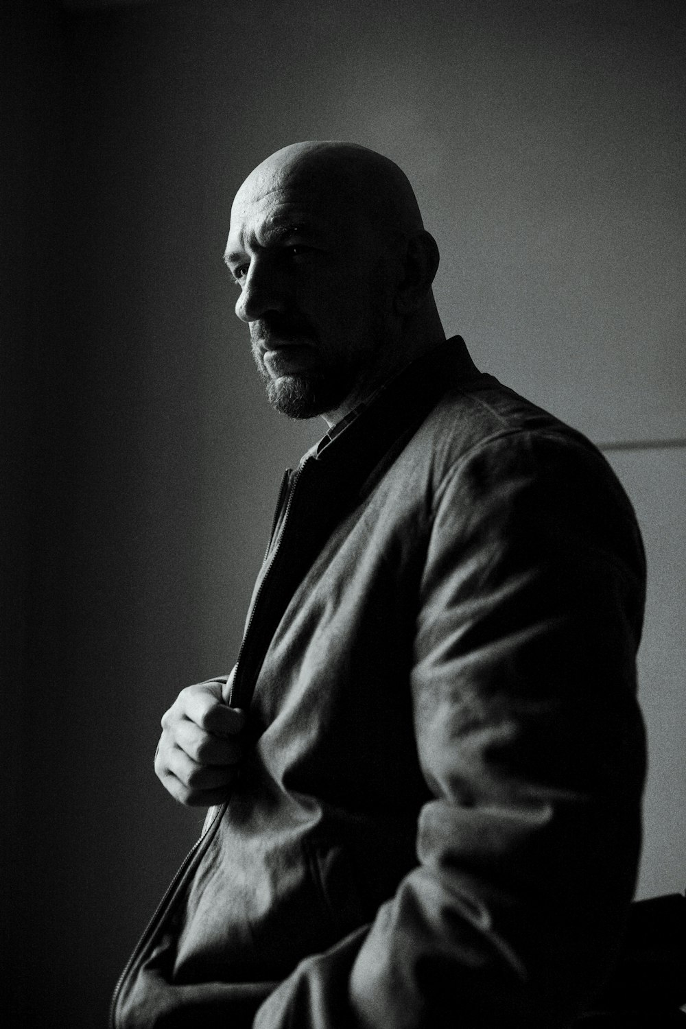 a black and white photo of a man in a suit