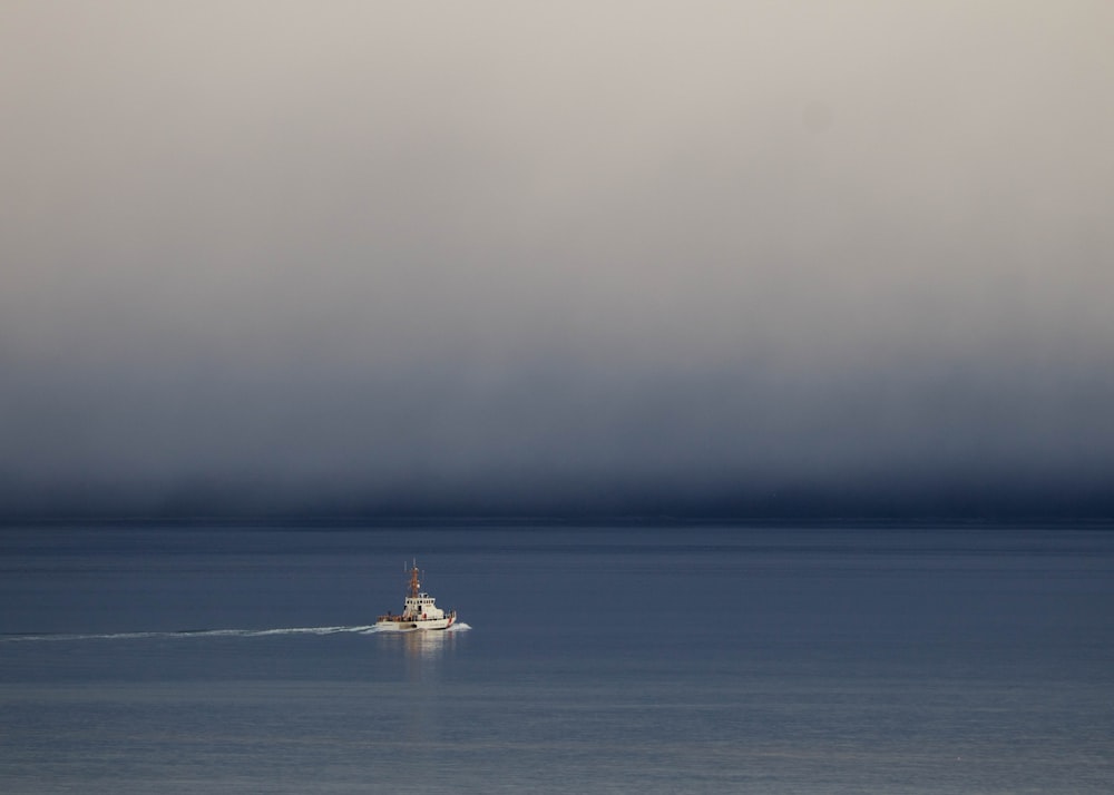 a small boat in a large body of water