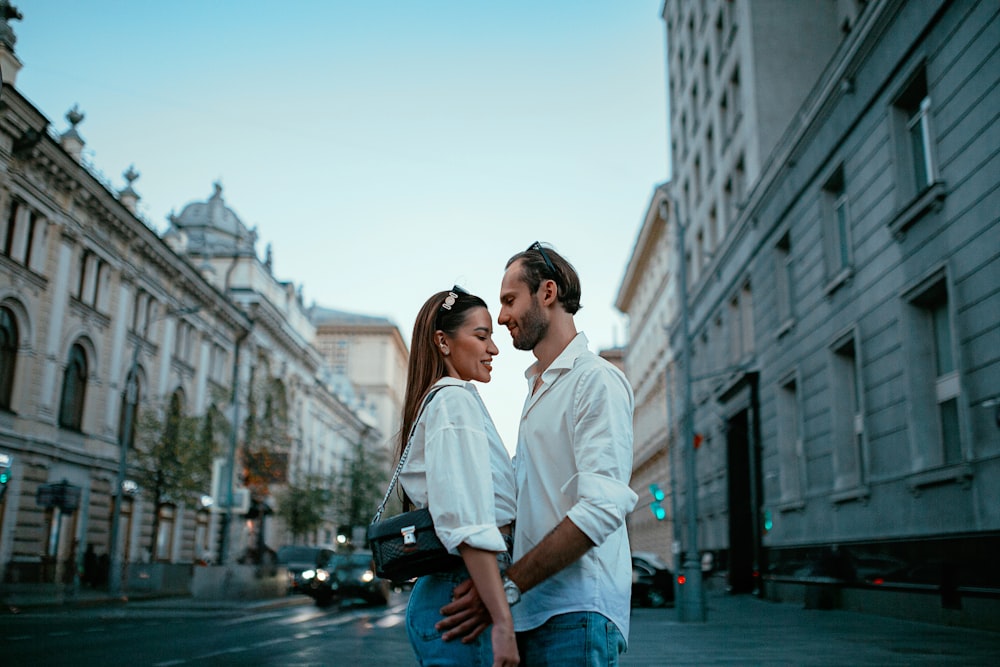 a man and a woman standing on a city street