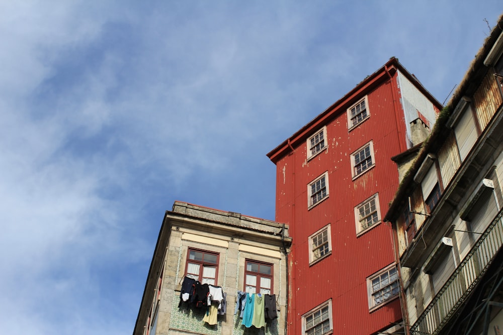 a red building with clothes hanging out to dry