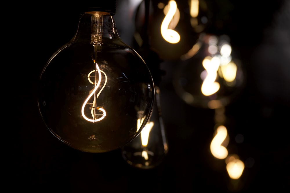 a light bulb with a musical note inside of it