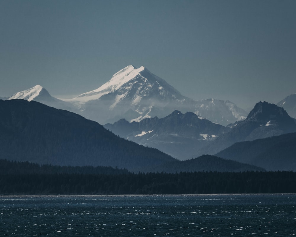 a mountain range with a body of water in front of it