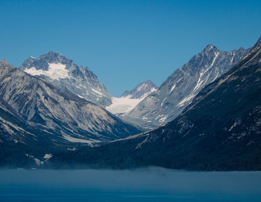 a mountain range with snow on the top of it