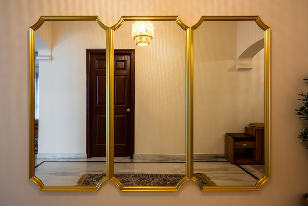 a mirror that is reflecting a door in a room
