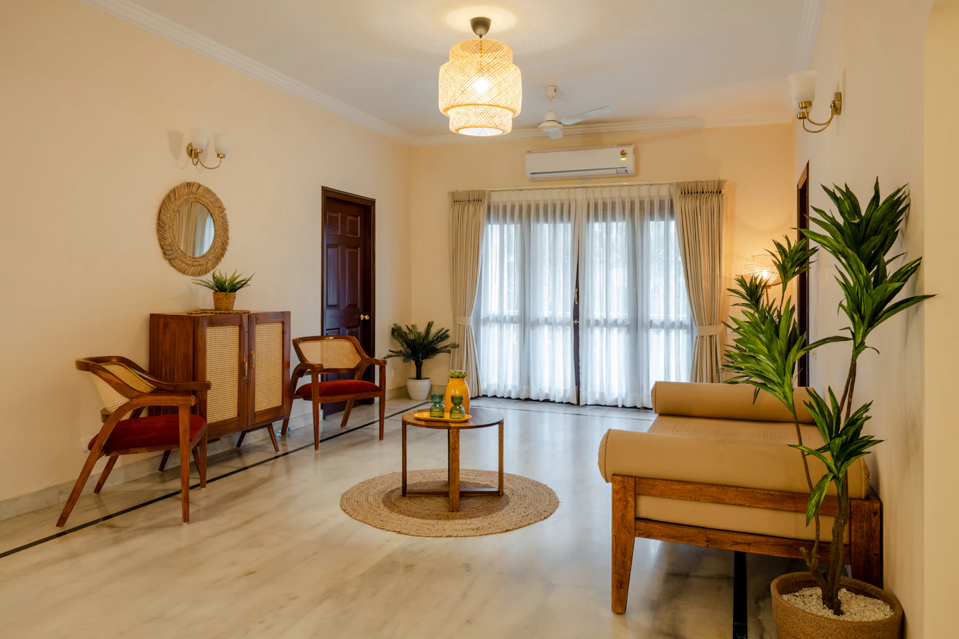 Indian room with warm ceiling light and chandelier