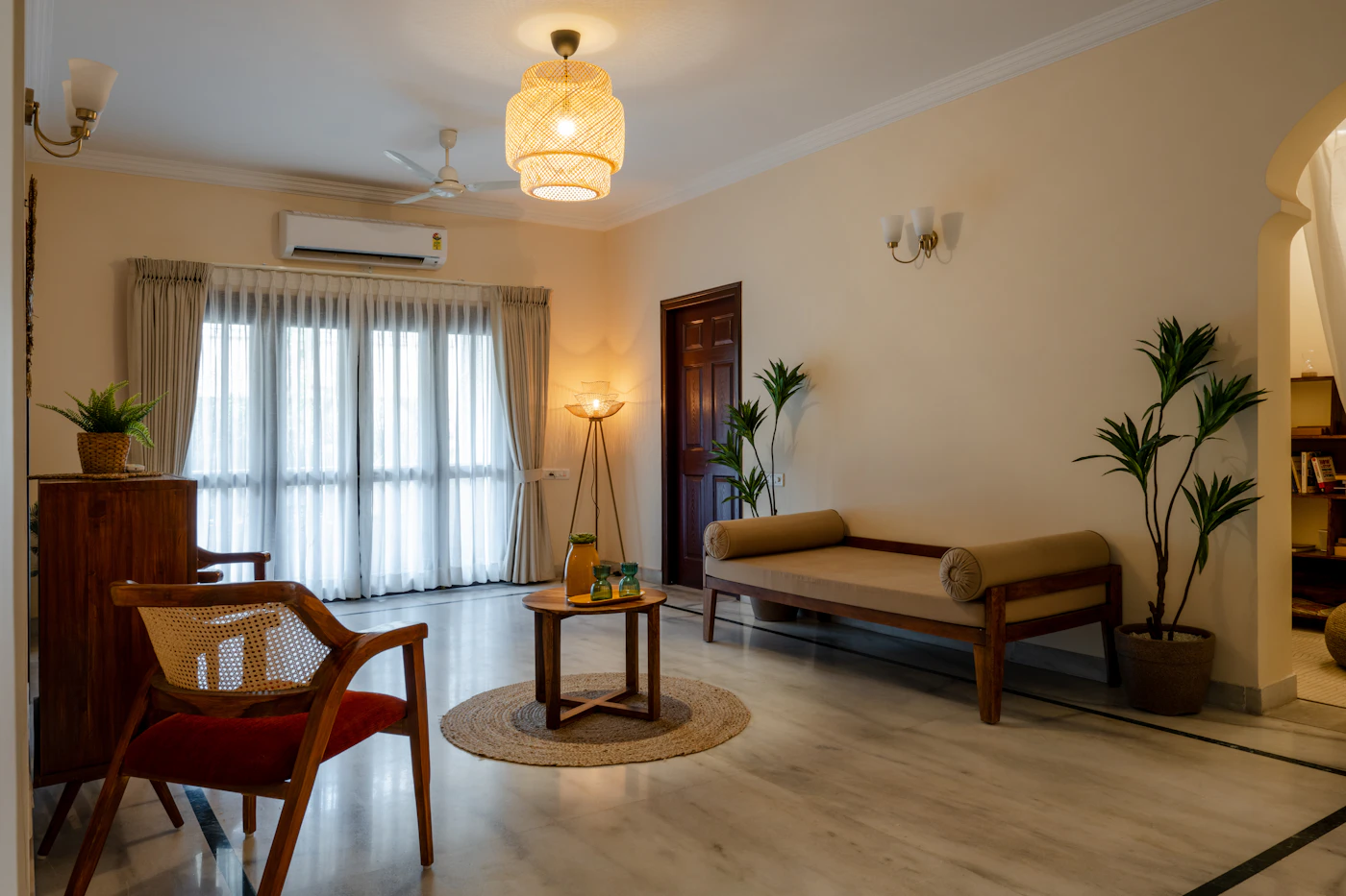 Indian living room with cane chairs and warm tones