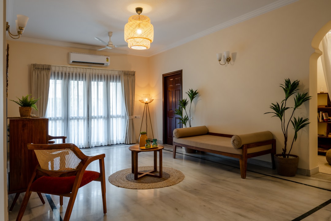 a living room filled with furniture and a window,