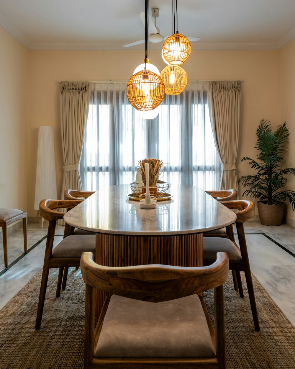 a dining room with a table and chairs