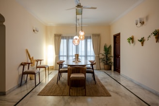 a dining room with a table and chairs