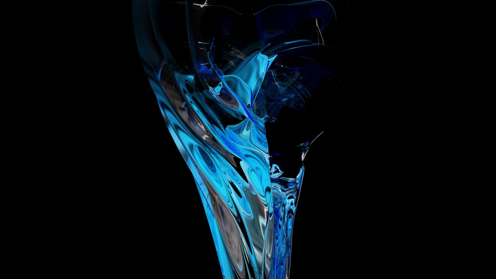a blue glass vase with a black background