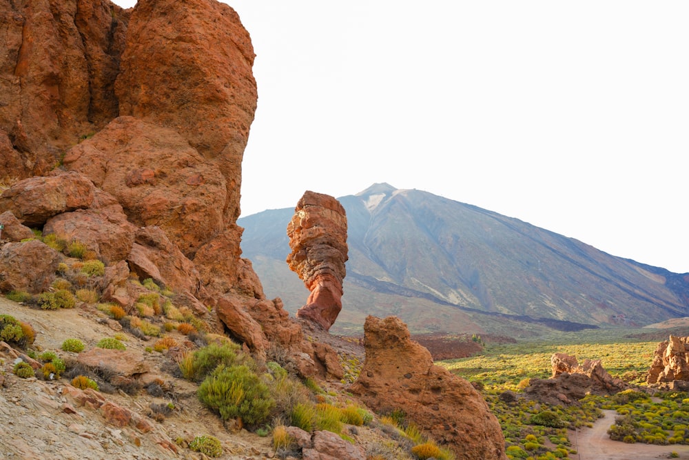 a large rock formation in the middle of a desert