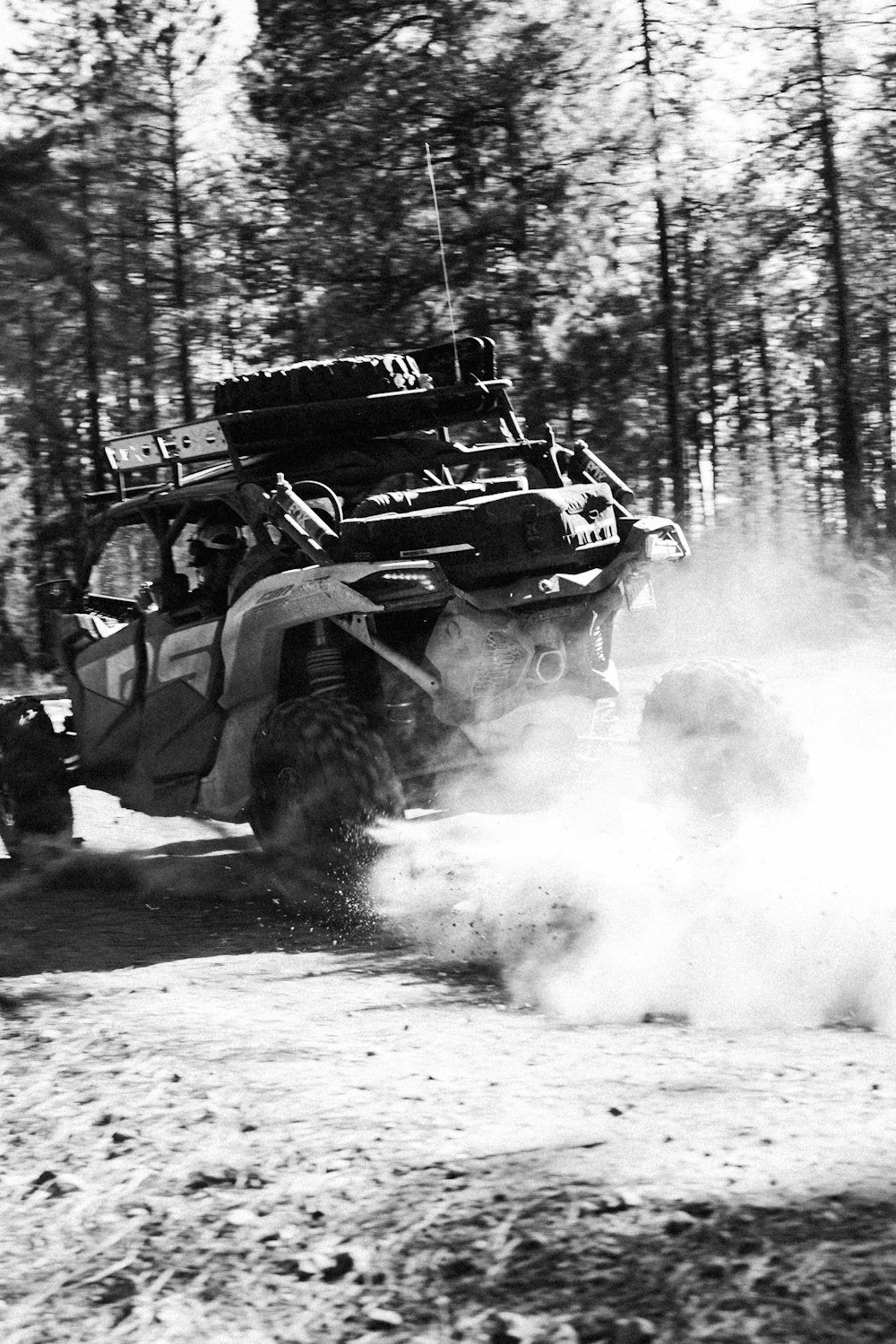 a black and white photo of a four - wheeled vehicle