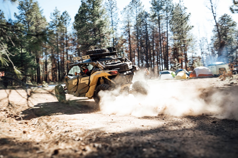 a person riding an atv on a dirt road