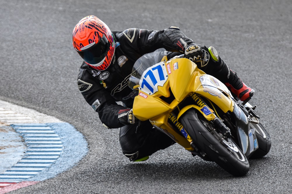 a person riding a motorcycle on a race track