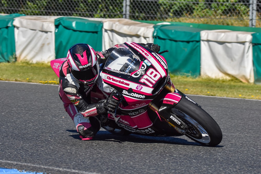 a person riding a motorcycle on a race track