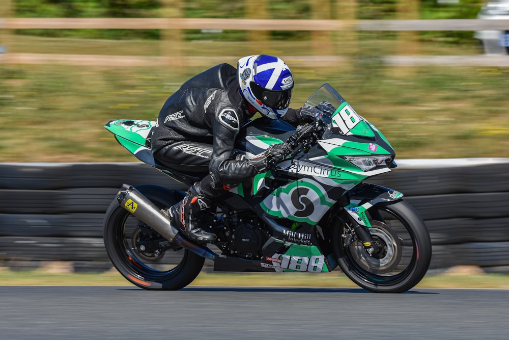 a person riding a motorcycle on a race track