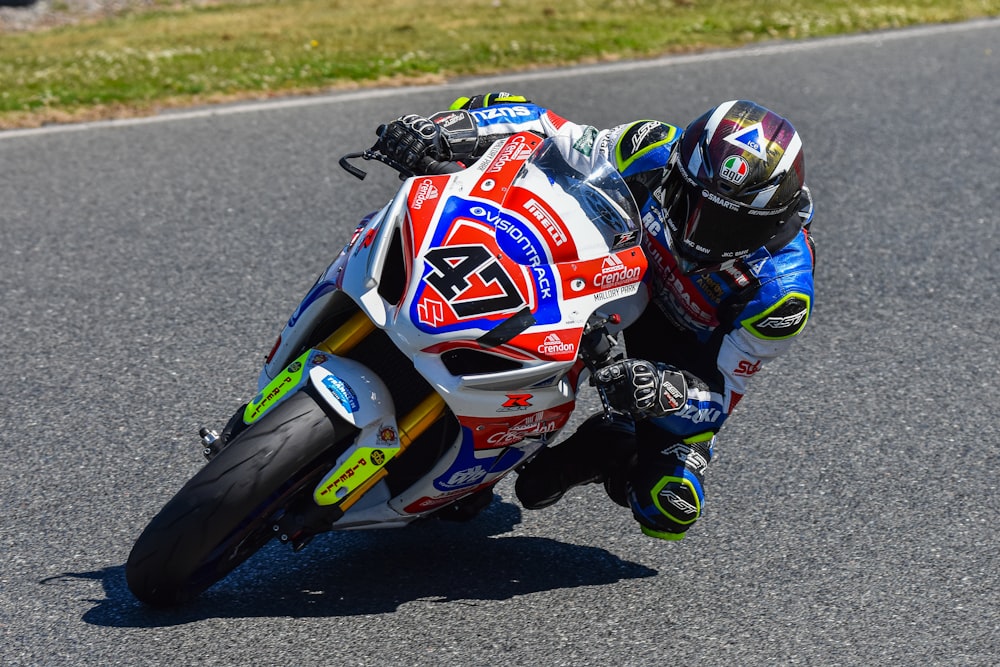 a person riding a motorcycle on a race track