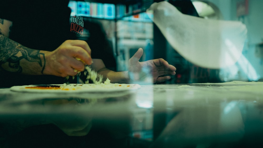 a man is preparing food in a kitchen