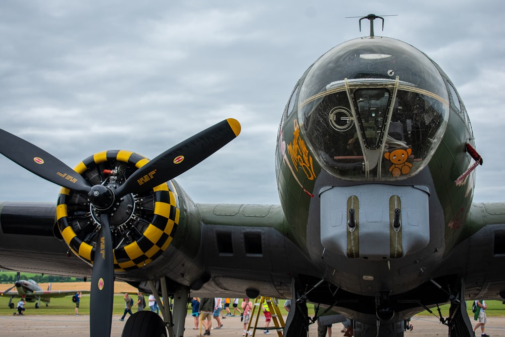 a close up of a propeller plane on a runway