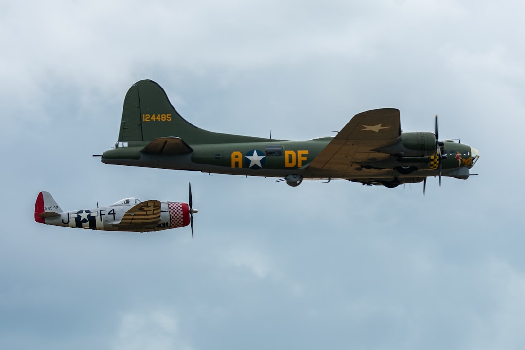 two airplanes flying side by side in the sky, B-17 Flying Fortress and a P-47 Thunderbolt