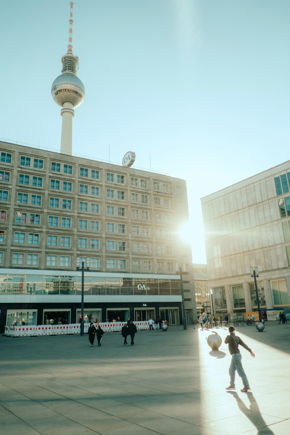 a person riding a skateboard in front of a tall building