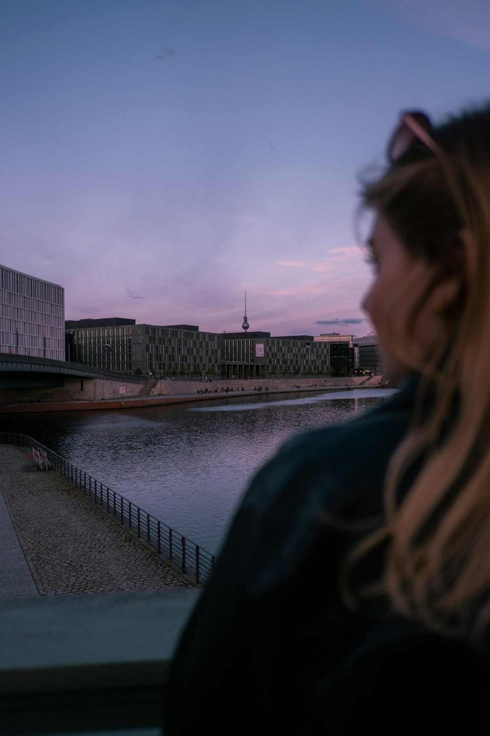 a woman looking out over a body of water